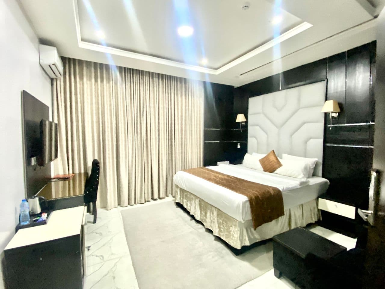 White Court Hotel suite with a king bed